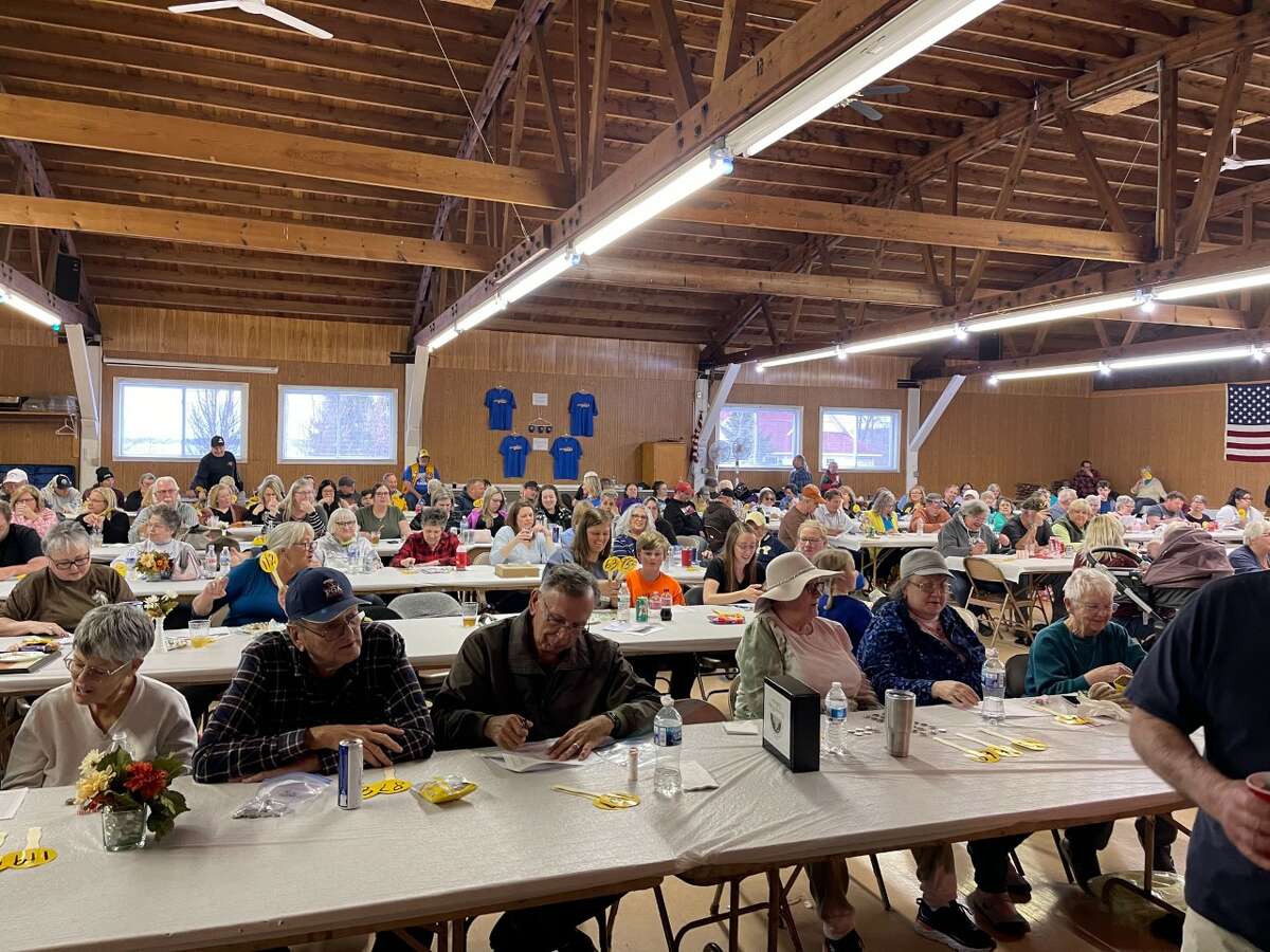 A packed house at this year's quarter paddle auction raised money to benefit the Onekama Lions Club