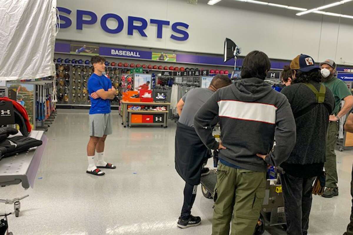 Bridgeland High School junior Lane Vicknair walks through an Academy Sports + Outdoors store in Richmond while filming a commercial for the sporting goods chain. Despite no acting experience, Vicknair was selected as the lead role in a 30-second commercial, which first aired in March and nationally on ESPN Inc.’s SEC Network among other sports networks.