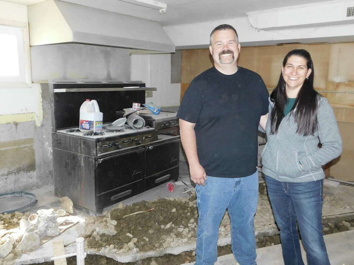 David Carroll, shown with his wife, Marie, plans to make a general store out of the old Beacon Grange hall on Route 254.