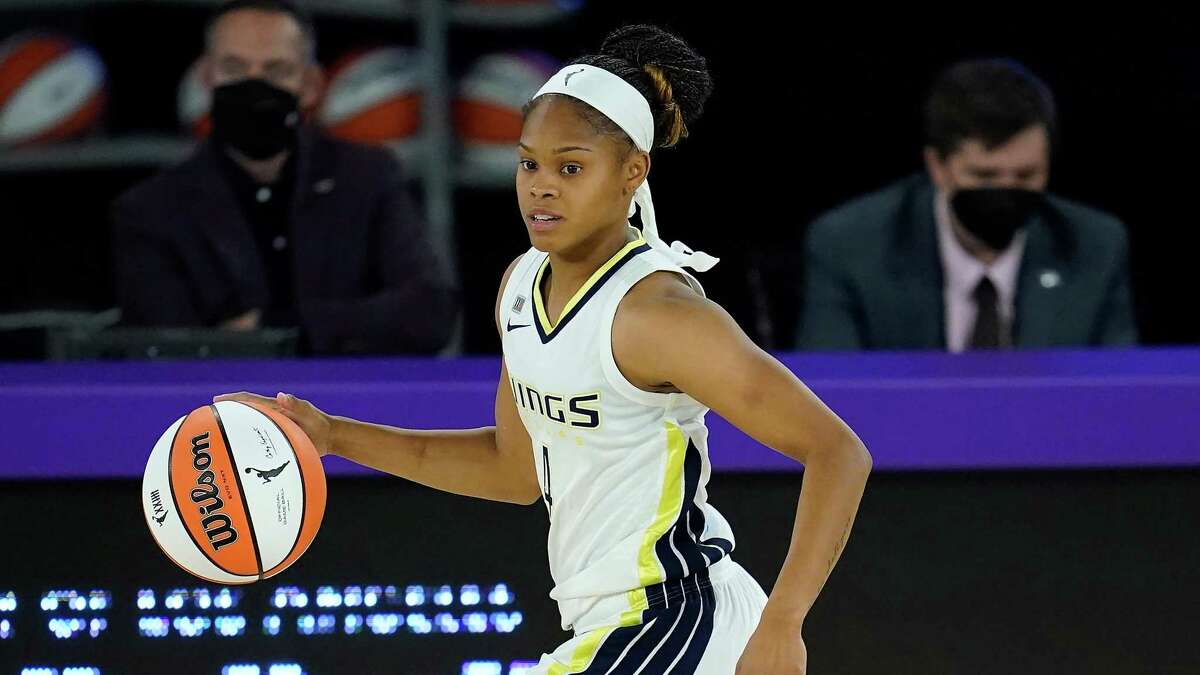 Dallas Wings guard Moriah Jefferson controls the ball in a 2021 game against Los Angeles. Jefferson, a former UConn star, was waived by the Wings on Monday.