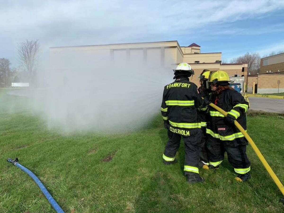 Mike Cederholm, fire chief for the Frankfort Fire Department, shows seniors how to use the fire hose as part of life skills class. Cederholm is hoping to get students interested in joining the fire service to help fill vacancies left by declining volunteerism. 
