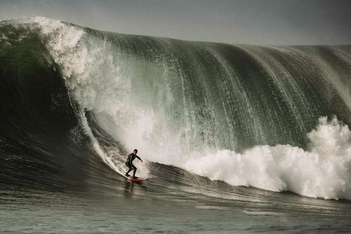Half Moon Bay surfer Luca Padua outruns a breaking Mavericks wave.