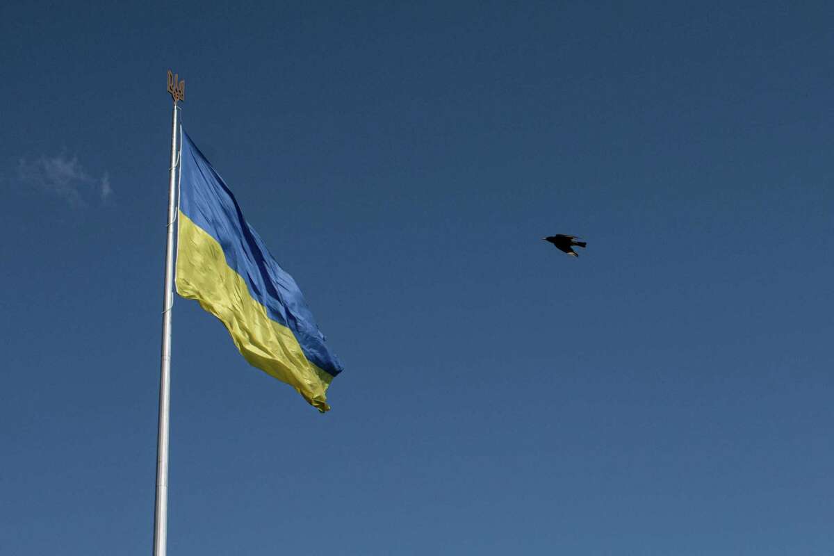 A bird flies by a giant Ukrainian national flag in the National Museum of the History of Ukraine in the Second World War, on May 9, 2022 in Kyiv, Ukraine.