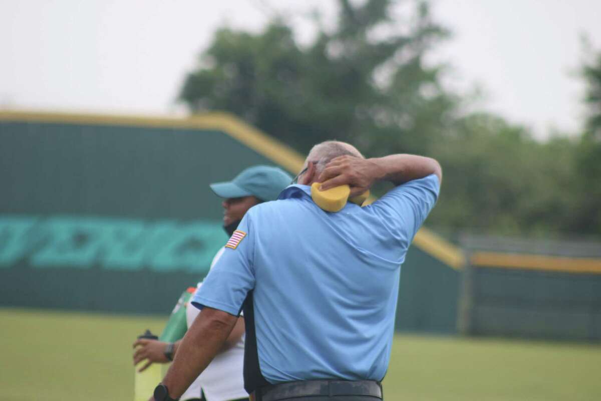 One of the umpires in the four-man crew Saturday enjoyed his cold sponge treats on the back of the neck.