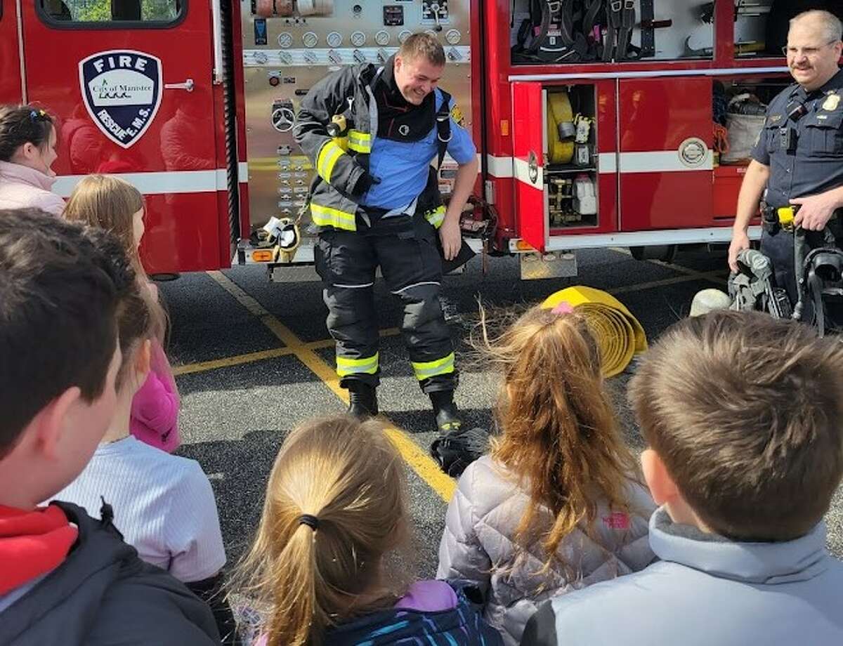 Police, firefighter meet with Trinity Lutheran School students