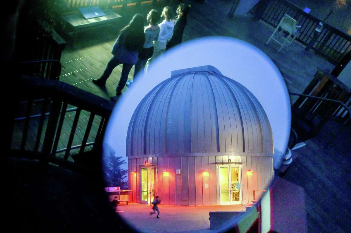 A child runs past the Rachel observatory at Chabot Space & Science Center on Friday, May 6, 2022, in Oakland, Calif. It houses a 20” refracting telescope installed in 1915.