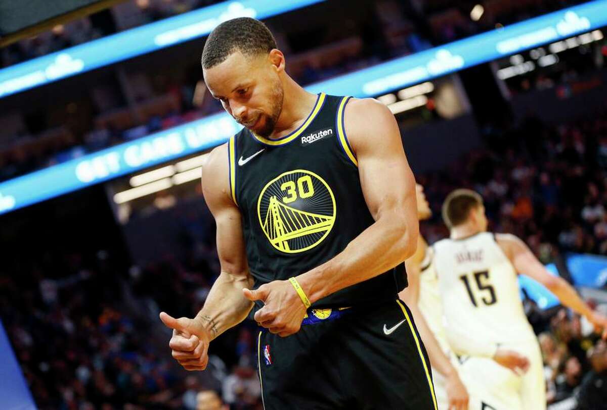 Golden State Warriors guard Stephen Curry (30) gives the cameras a thumbs up in the first half during Game 1 of the NBA first-round playoff series against the Denver Nuggets at Chase Center, Saturday, April 16, 2022, in San Francisco, Calif.