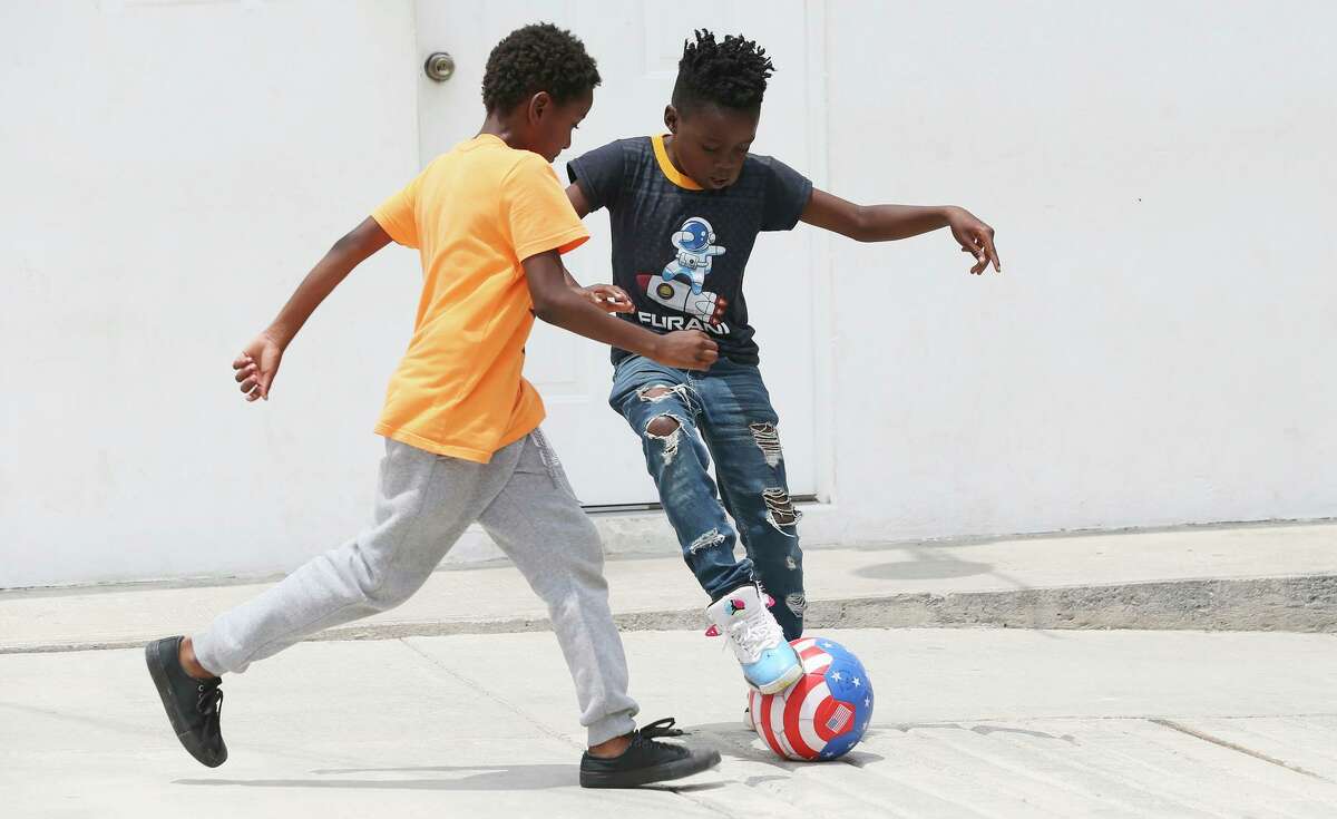 Jeffly Colas (right) plays with another migrant child at Senda de Vida in Reynosa, Mexico. This is the second time in less than a year that Jeffly has traveled with his father to the border in the hopes of staking a legal asylum claim and reuniting with his mother and three siblings in the Bay Area.