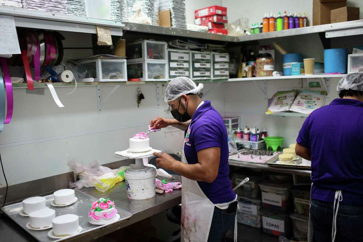 Fernando Mendoza decorates Mother’s Day cakes on Monday, May 9, 2022, at Panaderia Tierra Caliente in Houston.