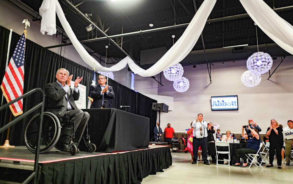 Texas Governor Greg Abbott, left, speaks about his Parental Bill of Rights as Rep. John Lujan stands by him at the PicaPica Plaza Event Center on the Southside of San Antonio on Monday, May 9, 2022. Several hundred Republican faithful attended the event.
