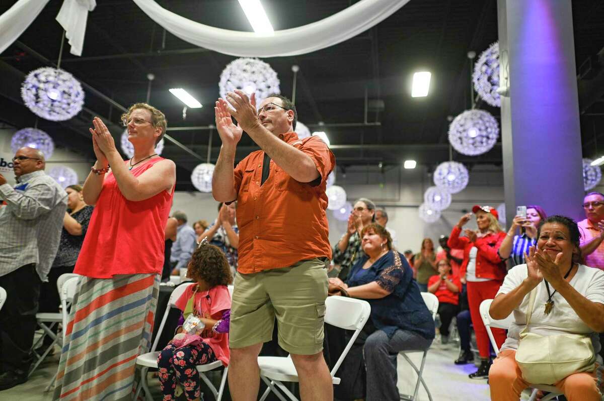 People applaud as Texas Governor Greg Abbott speaks about his Parental Bill of Rights at the PicaPica Plaza Event Center on the Southside of San Antonio on Monday, May 9, 2022.