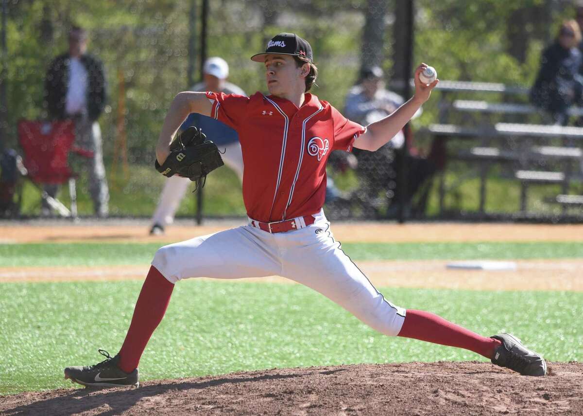 New Canaan's Tristan Pearl fires in a pitch during a baseball game against Darien on Monday, May 9, 2022.