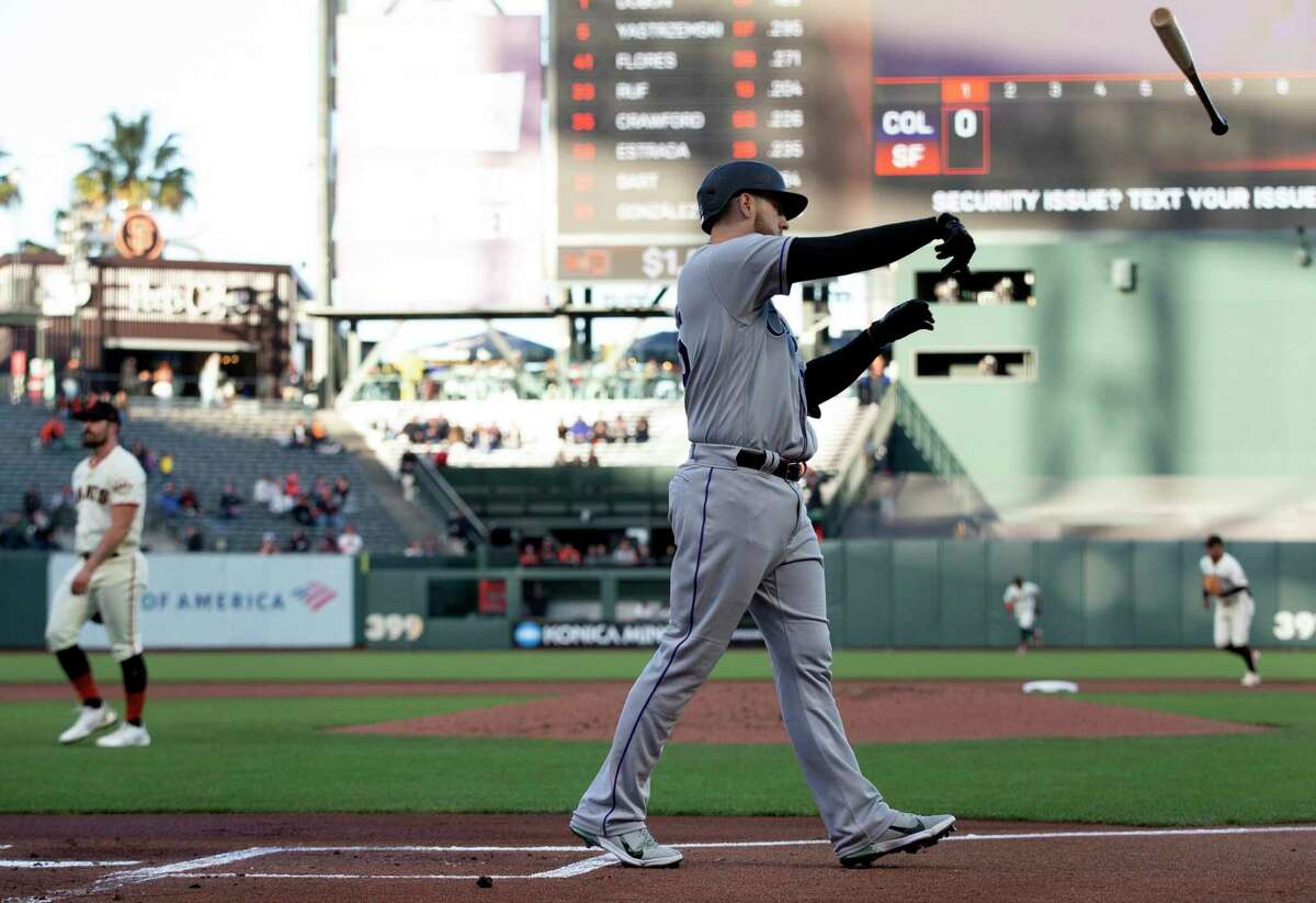 Colorado Rockies' C.J. Cron (25) throws his bat after striking out against San Francisco Giants starting pitcher Carlos Rodon during the first inning of a baseball game, Monday, May 9, 2022, in San Francisco. (AP Photo/D. Ross Cameron)