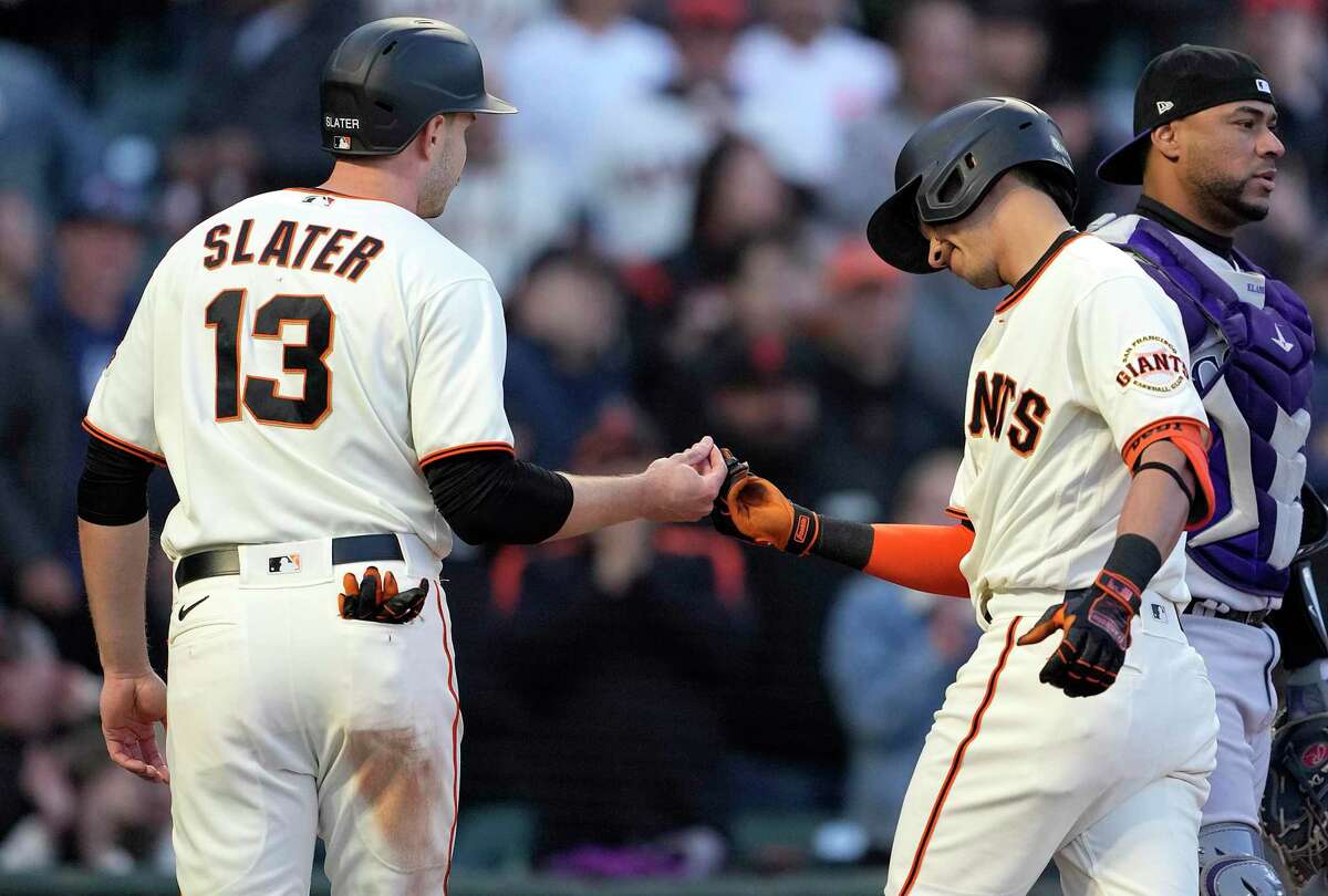 SAN FRANCISCO, CALIFORNIA - MAY 09: Mauricio Dubon #1 of the San Francisco Giants is congratulated by Austin Slater #13 after Dubon hit a two-run home run against the Colorado Rockies in the bottom of the third inning at Oracle Park on May 09, 2022 in San Francisco, California. (Photo by Thearon W. Henderson/Getty Images)