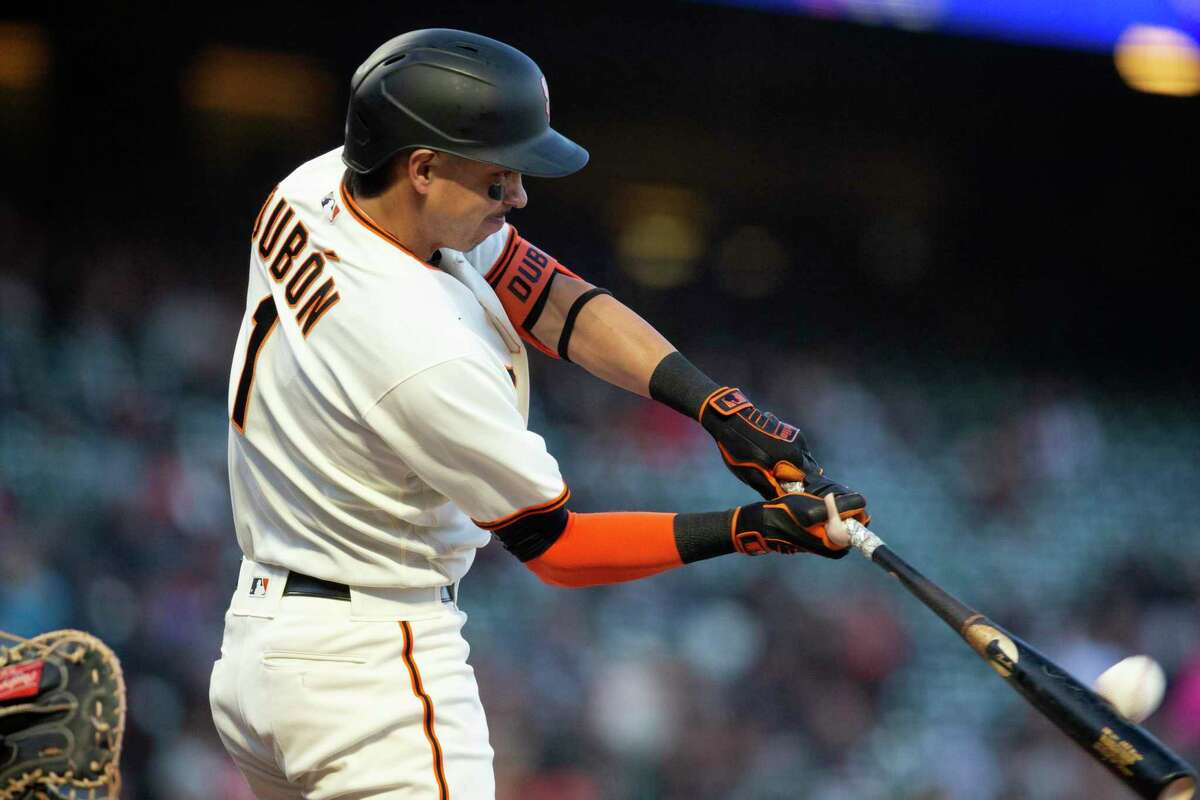 San Francisco Giants' Mauricio Dubón (1) connects for a two-run home run off Colorado Rockies starting pitcher Austin Gomber during the third inning of a baseball game, Monday, May 9, 2022, in San Francisco. Giants' Austin Slater also scored on the hit. (AP Photo/D. Ross Cameron)