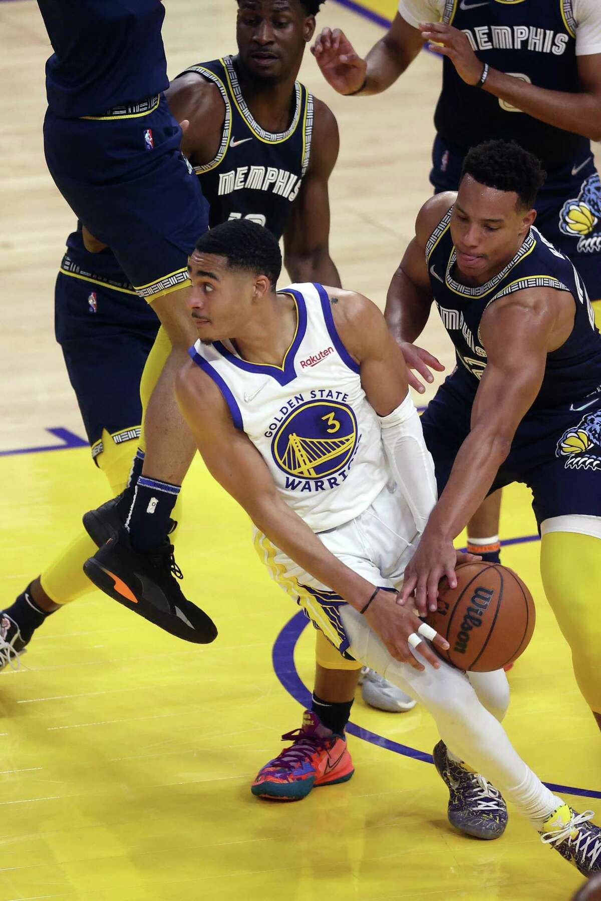 Golden State Warriors’ Jordan Poole has the ball stolen by Memphis Grizzlies’ Desmond Bane in 2nd quarter during Game 4 of NBA Western Conference Semifinals at Chase Center in San Francisco, Calif., on Monday, May 9, 2022.