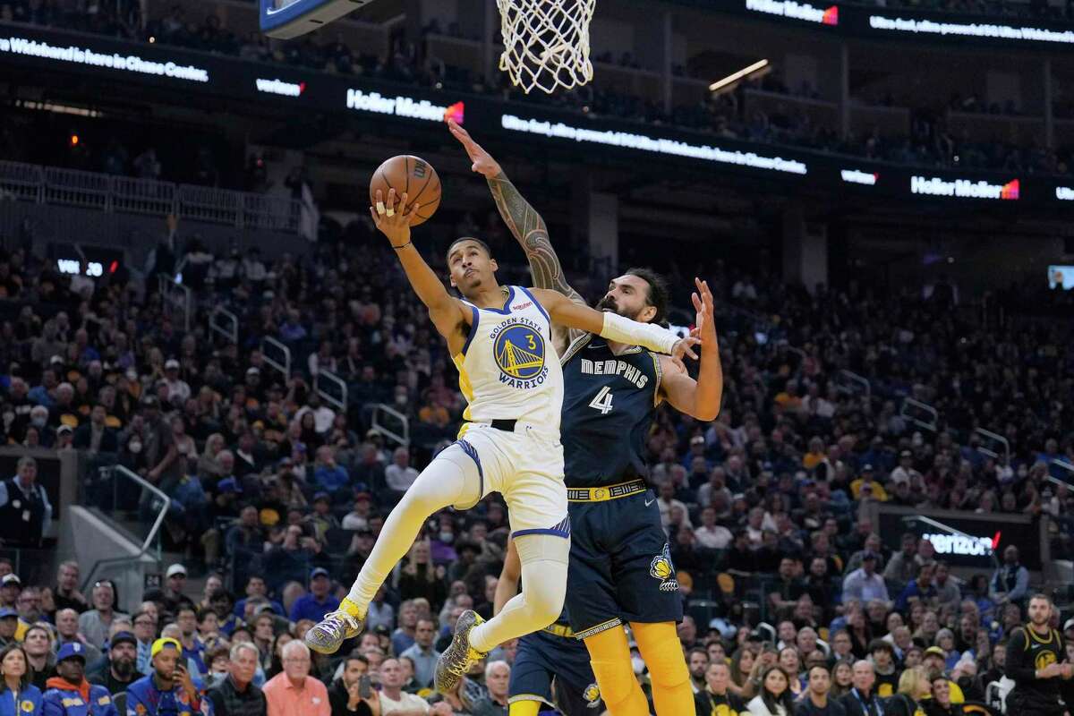 Golden State Warriors guard Jordan Poole (3) drives to the basket against Memphis Grizzlies center Steven Adams (4) during the first half of Game 4 of an NBA basketball Western Conference playoff semifinal in San Francisco, Monday, May 9, 2022. (AP Photo/Tony Avelar)