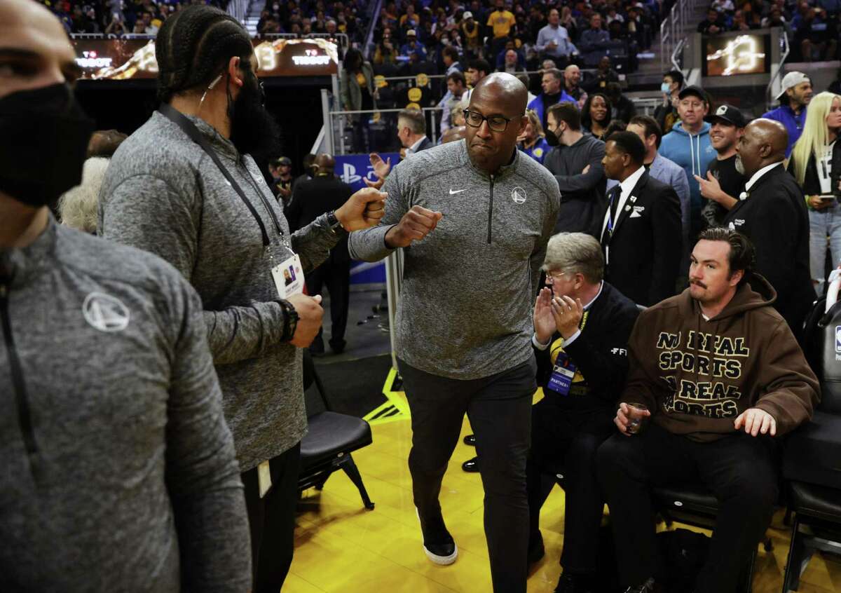 Assistant coach Mike Brown enters the court to take the helm as Steve Kerr entered health and safety protocols as the Golden State Warriors played the Memphis Grizzlies in Game 4 of the Western Conference Semifinals of the NBA Playoffs at Chase Center, in San Francisco, Calif., on Monday, May 9, 2022.