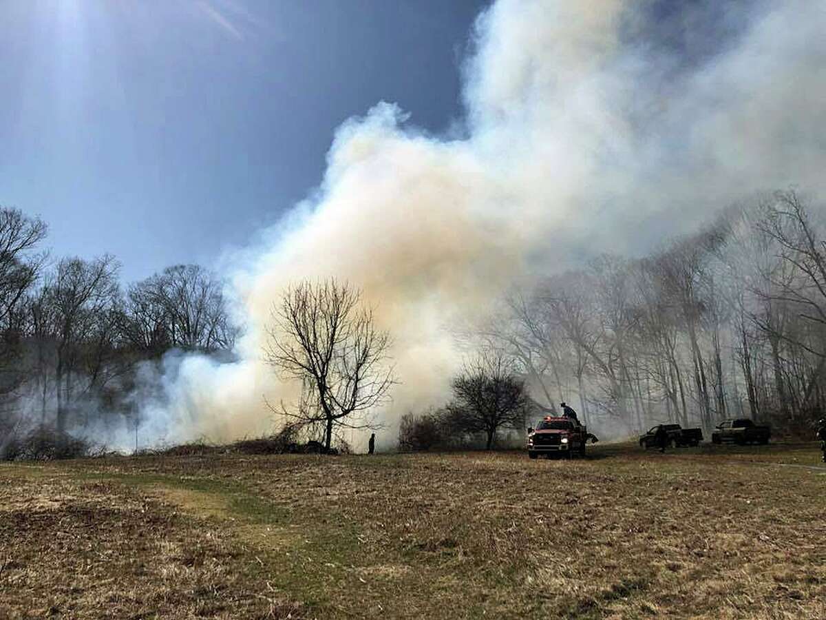 FILE PHOTO: A brush fire in Derby in 2018. The risk of brush fires in Connecticut remains high as dry and windy conditions are expected again on Tuesday.