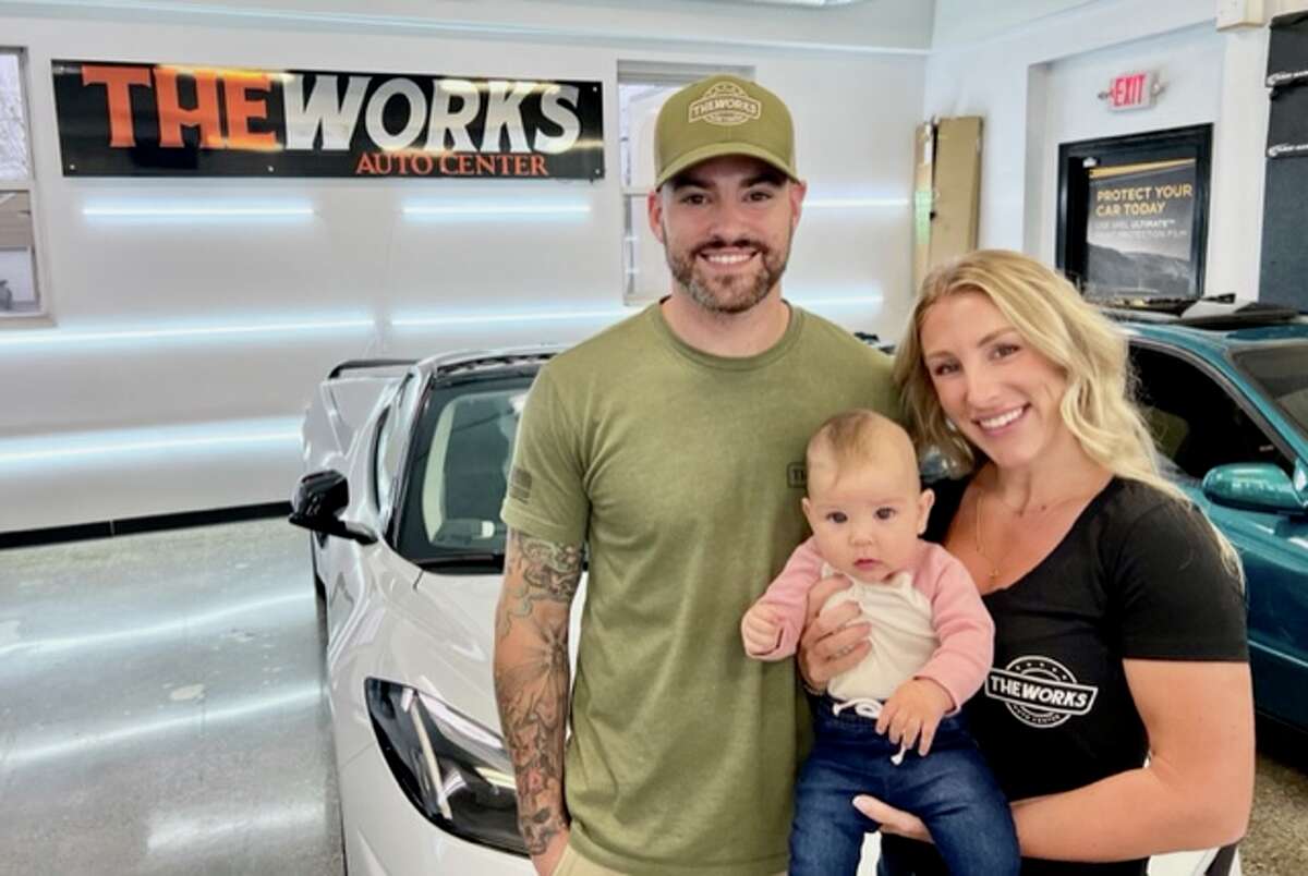Kory Asher and his wife, Shelby, often bring their baby, Navy, to The Works Auto Center that they own. 