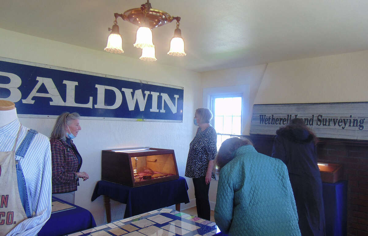 Docent Susie Baradford Tripp leads a group of visitors on a tour through the Lake County Historical Museum.