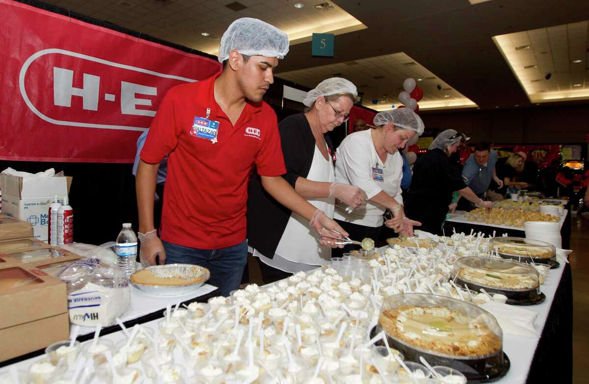 H-E-B employees assemble samples during the Conroe/Lake Conroe Area Chamber of Commerce's Tastefest at the Lone Star Convention & Expo Center, Thursday, June 6, 2019, in Conroe. The annual culinary event showcased food and drinks from more than 25 area restaurants, caters, wineries and breweries.