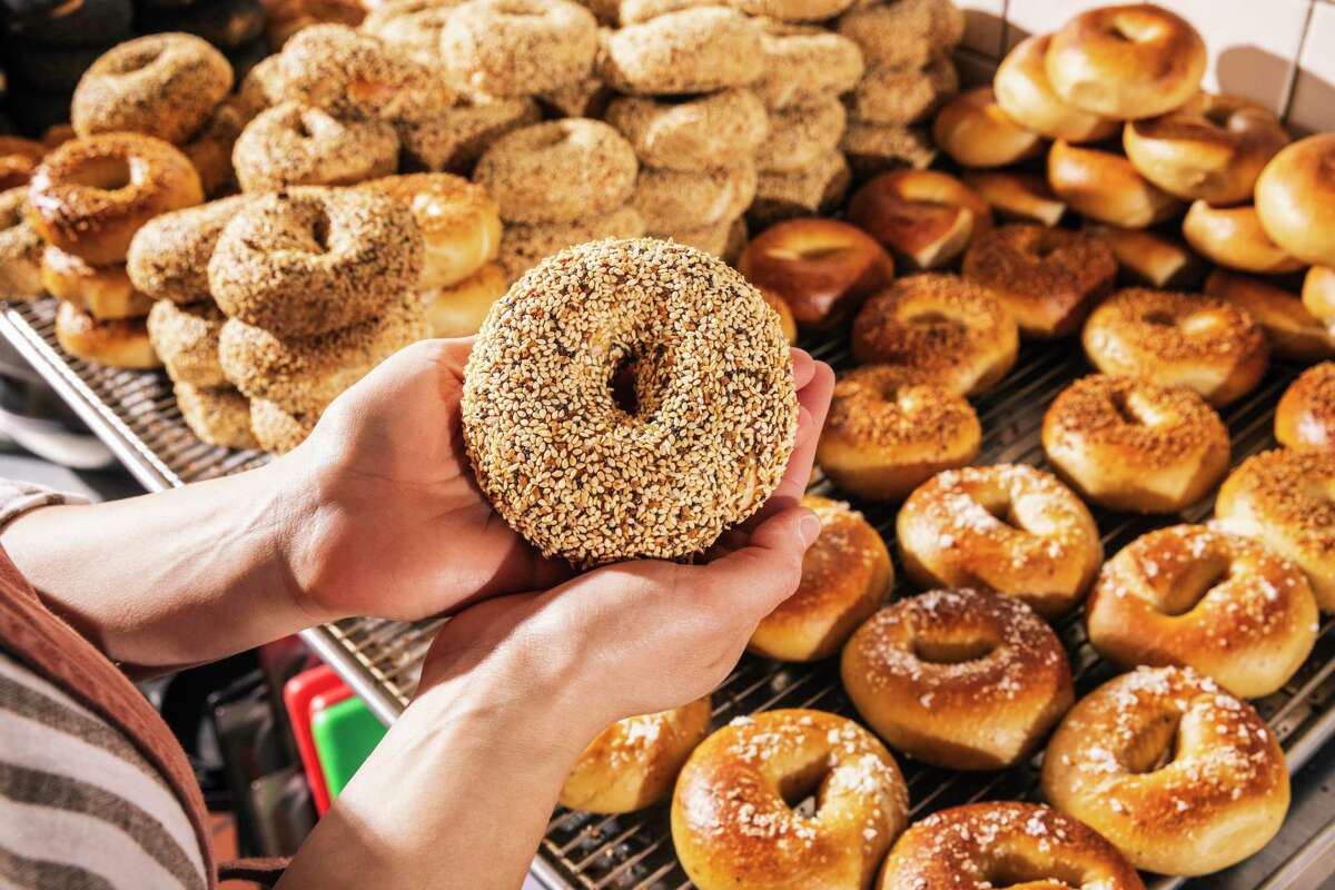 Reesa Kashuk, owner of Poppy Bagels, holds a fresh everything bagel. She’s opening her first bagel shop in Oakland this year.