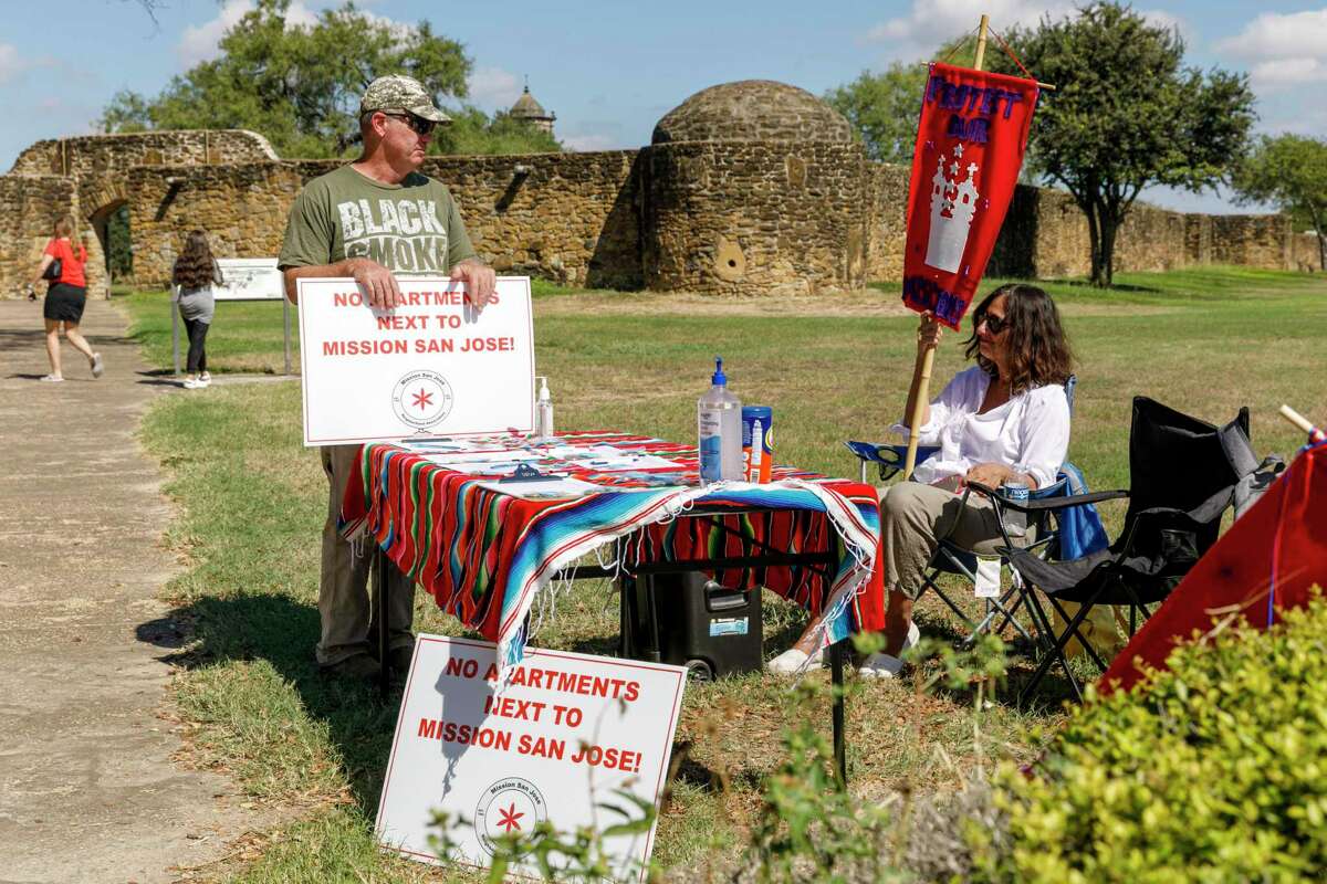 Brady Alexander, left, and Cynthia Spielman, Cynthia Spielman, who serves on the steering committee of the Tier One Neighborhood Coalition, an alliance of more than 50 neighborhood groups in the San Antonio area and on the board of the Beacon Hill Neighborhood Association.  They were at a petition table set up by the Mission San Jose Neighborhood Association at the entrance of the Missions National Historical Park in 2021.