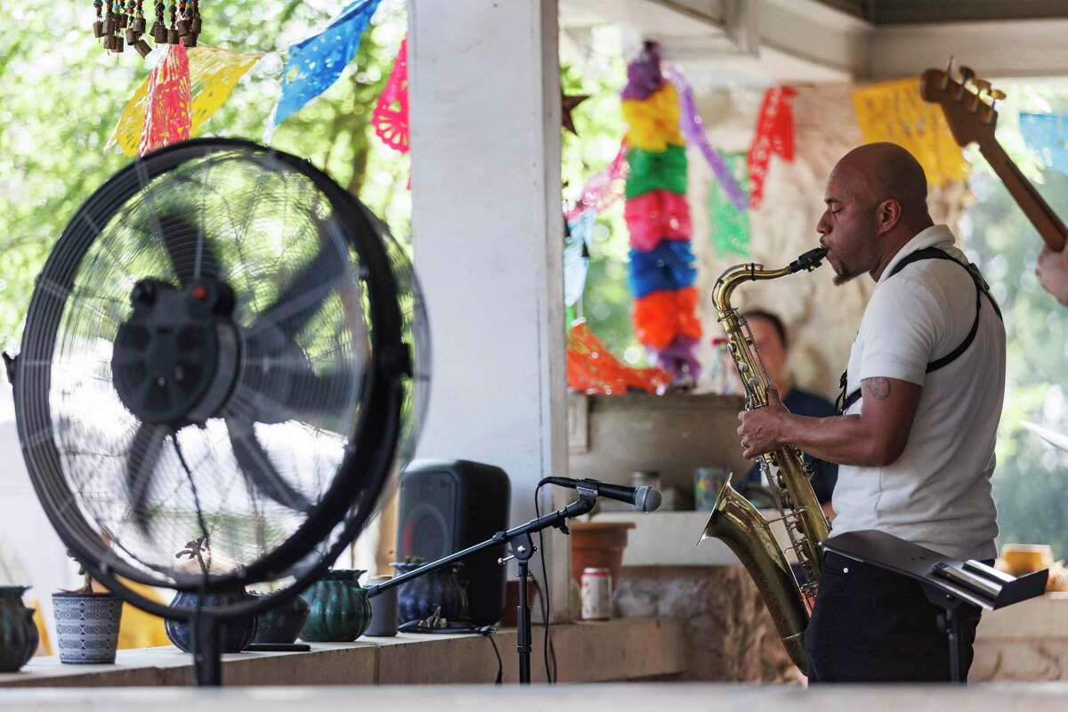 Keith Nabors plays saxophone with his jazz band the Kevin Nabors Quartet on a West Mulberry porch during the recent Alta Vista and Beacon Hill Porch Fest.