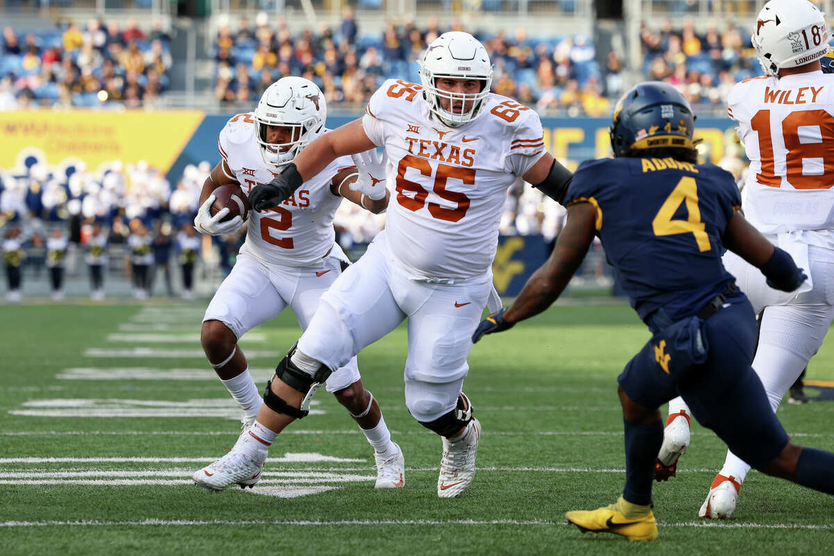 Jake Majors (65), who’s started the past 14 games at center, is back as part of a Texas offensive line group that landed several blue-chip prospects in the latest recruiting cycle.