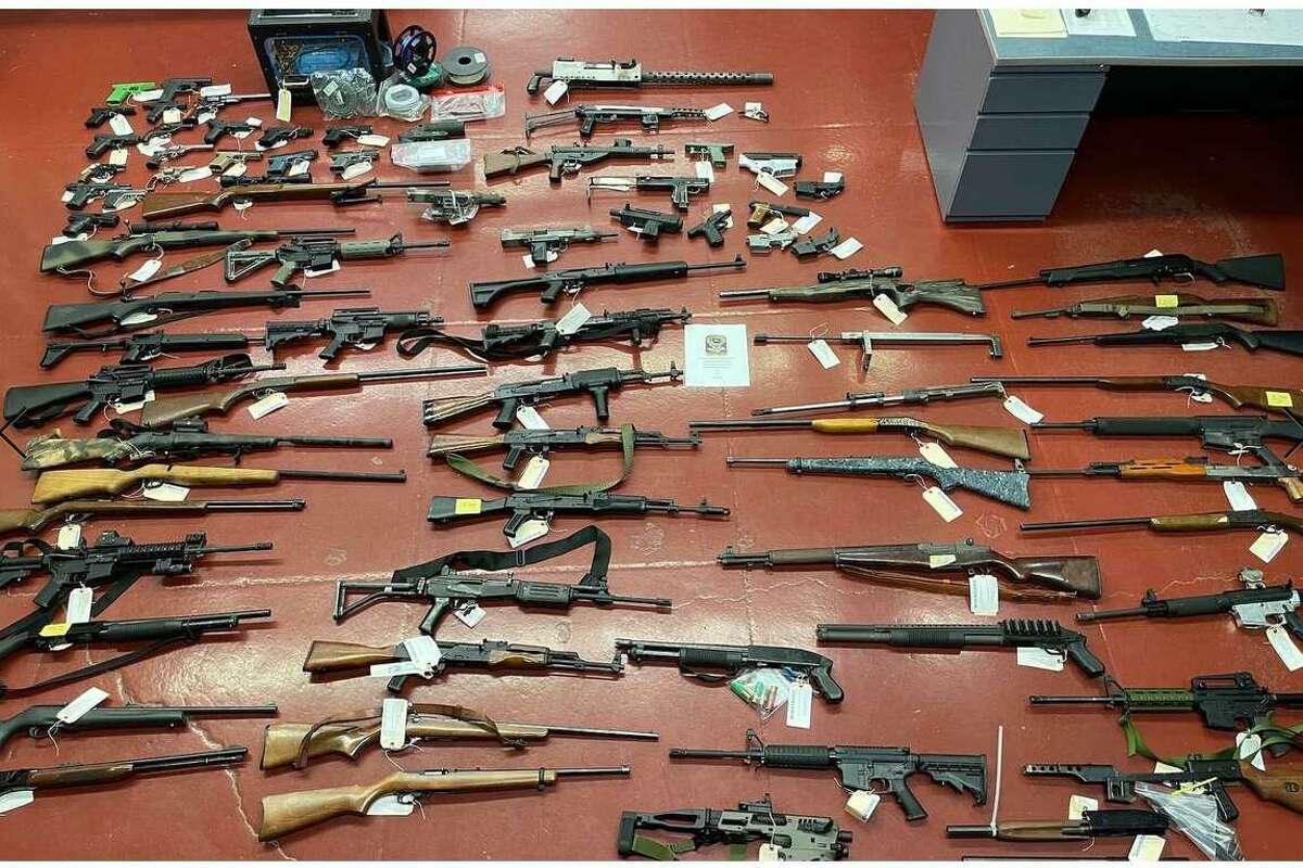 Guns seized by investigators during a probe of illegal gun sales. Steven Mastrianni was charged following a search of his New Britain home, police said.