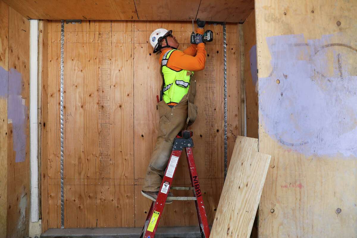 Carpenter Royce Vaughn works at an affordable housing construction site in San Francisco on April 15, 2022.