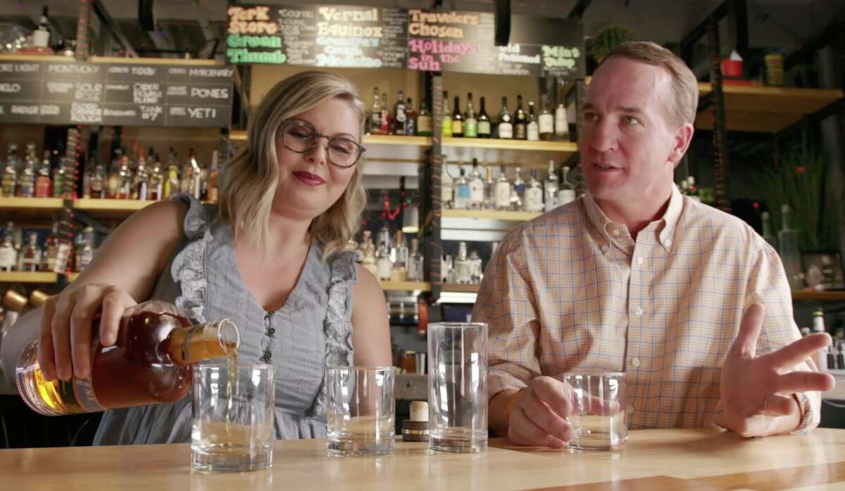 Sweetens Cove master blender Marianne Eaves with company co-founder Peyton Manning in Denver.