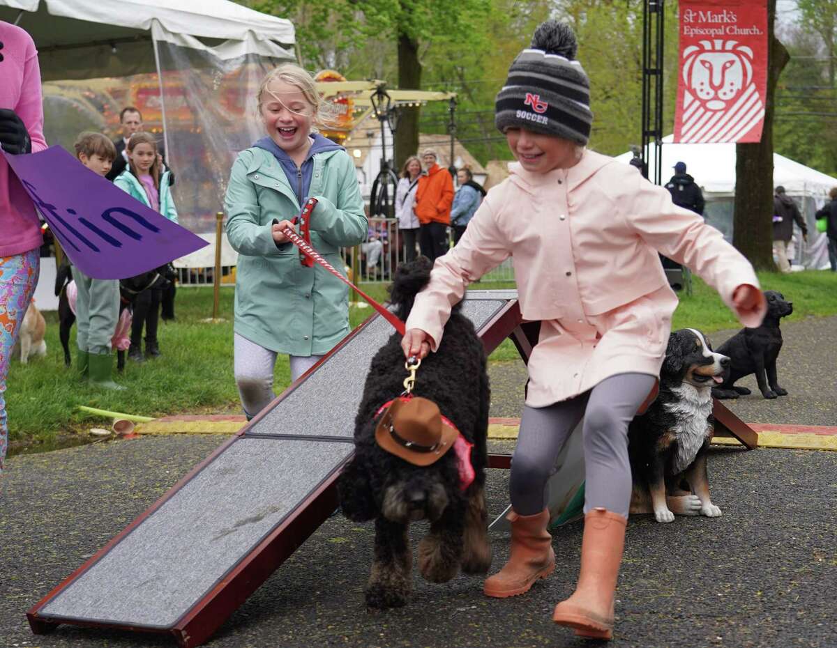 Grace and Claire Amundsen showed their dog America in the Rescue Dog Show at St. Mark's May Fair, in New Canaan, May 7, 2022.