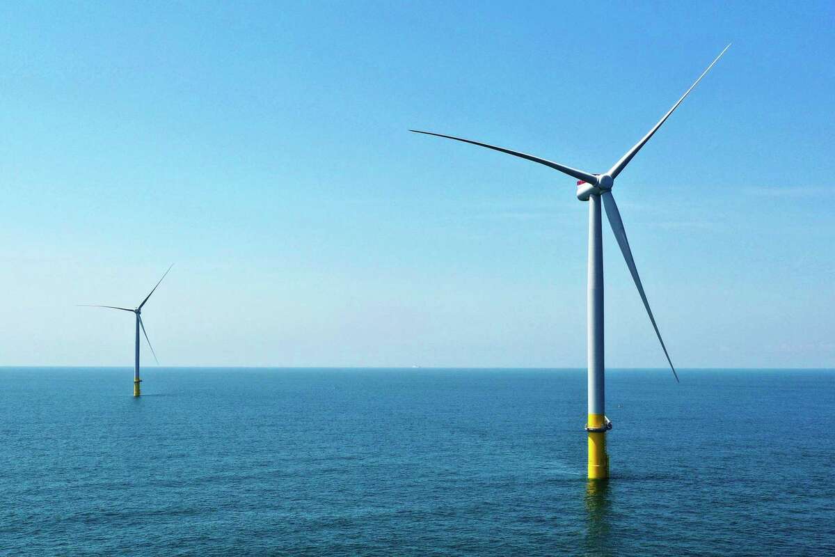 Two of the offshore wind turbines which have been constructed off the coast of Virginia Beach, Va. Dominion Energy seeks to build what it calls the country’s largest offshore wind farm in the Atlantic Ocean.