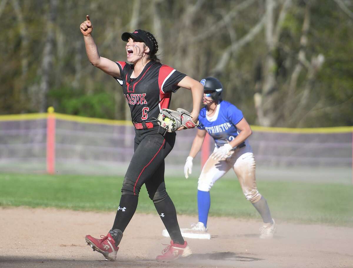 Masuk shortstop Julie Bacoulis celebrates her first of two runners tagged out trying to steal second base during the first inning of their girls softball game with Southington at Masuk High School in Monroe, Conn. on Tuesday, May 10, 2022.