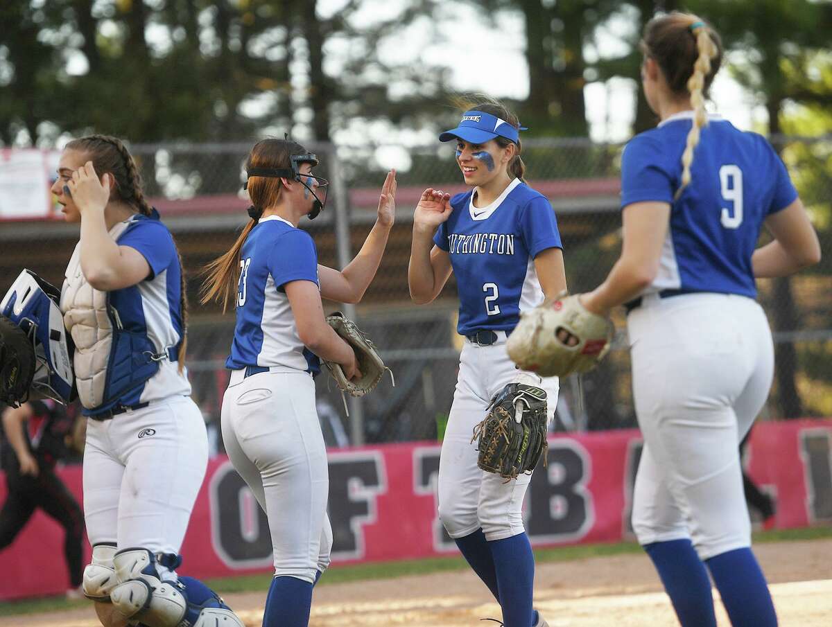 Southington players celebrate a scoreless inning during their team's girls softball game with Masuk at Masuk High School in Monroe, Conn. on Tuesday, May 10, 2022.