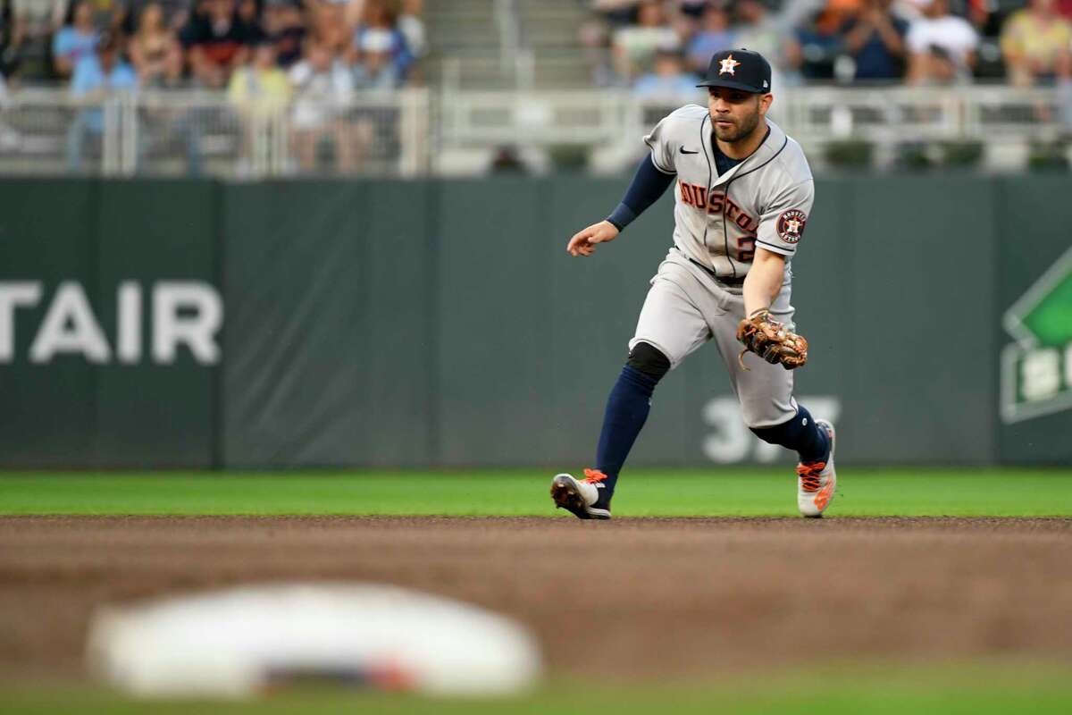 Houston Astros second baseman Jose Altuve catches a ground ball hit by Minnesota Twins' Jose Miranda and makes the throw to first for the out during the fourth inning of a baseball game, Tuesday, May 10, 2022, in Minneapolis. (AP Photo/Craig Lassig)