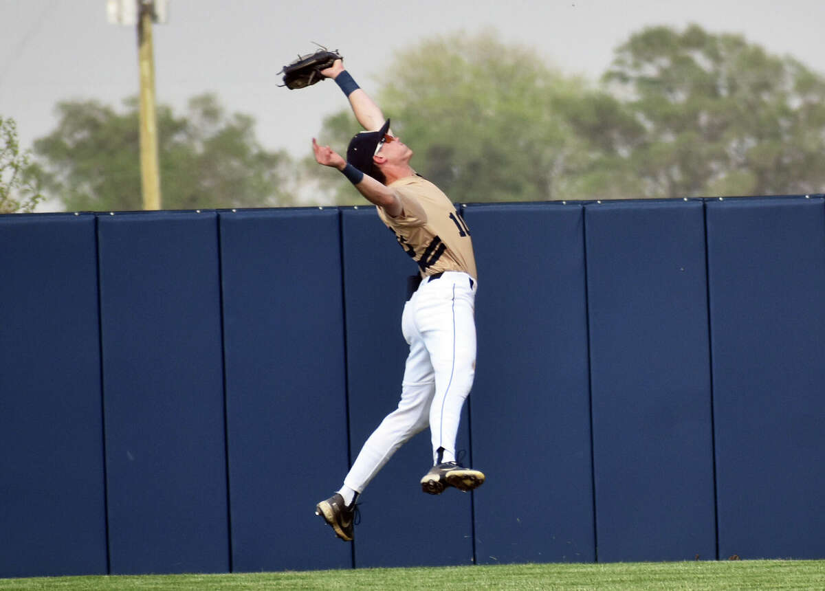Father McGivney's Jackson Rodgers makes a leaping catch in center field against Newton on Tuesday in Glen Carbon.