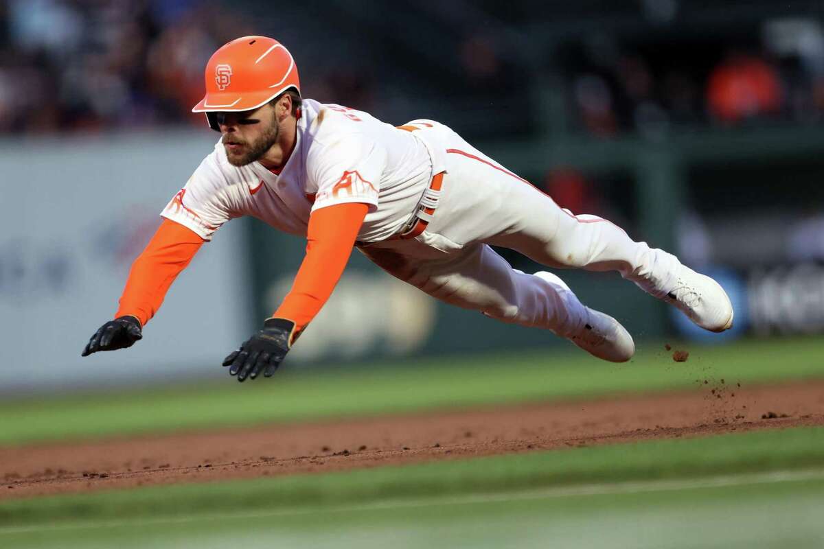 San Francisco Giants’ Luis Gonzalez slides into third base on Curt Casali’s 4th inning single against Colorado Rockies during MLB game at Oracle Park in San Francisco, Calif., on Tuesday, May 10, 2022.