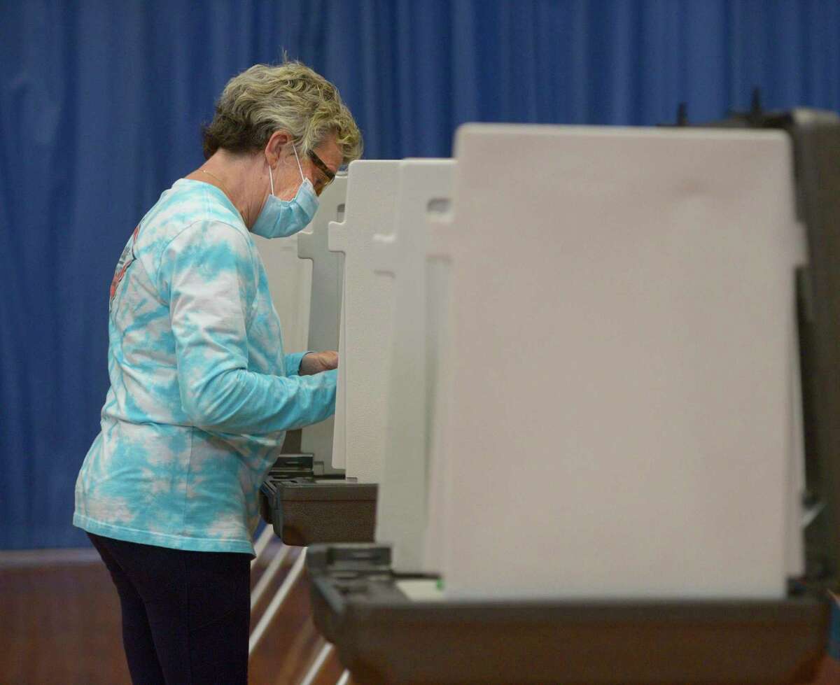 Valerie Guthrie, of Ridgefield, votes in the budget referendum in Yanity Gymnasium on Tuesday May 10, 2022, Ridgefield, Conn.