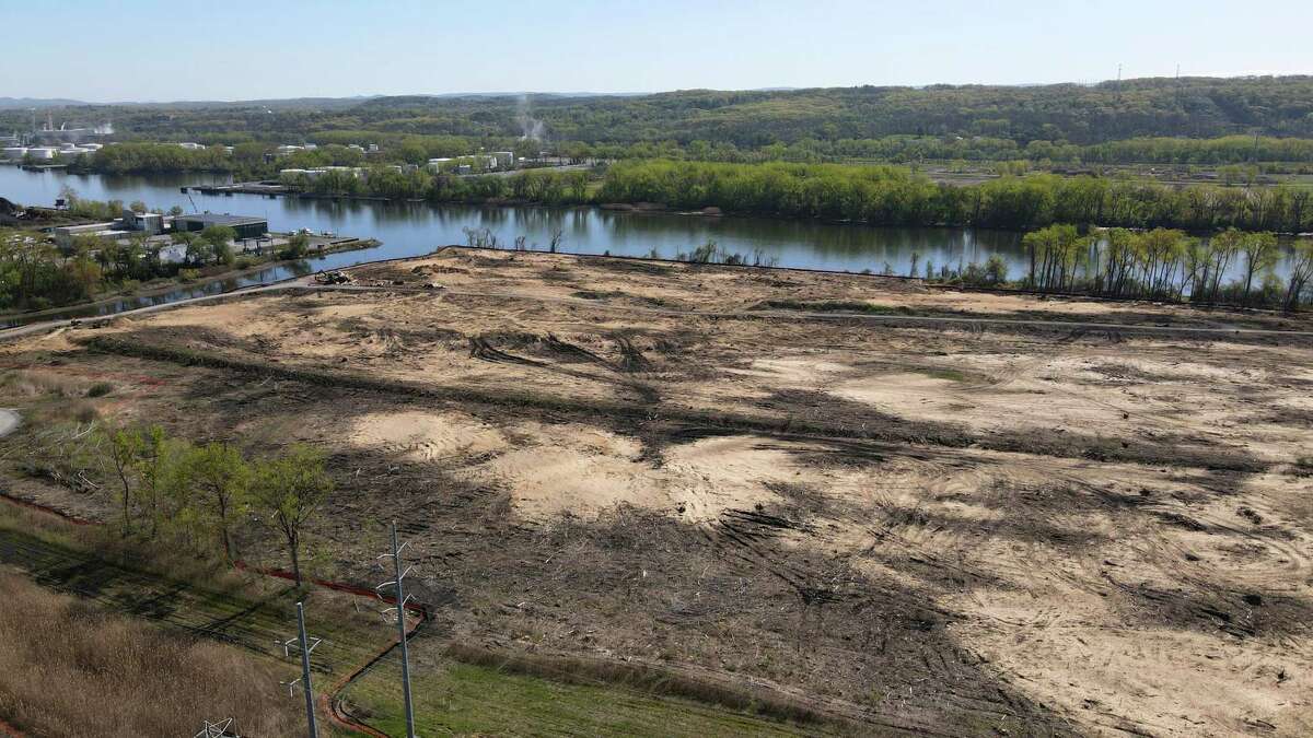 Land is cleared for construction of an offshore wind turbine assembly facility along the Hudson River on Wednesday, May 11, 2022, at the Port of Albany in Glenmont, N.Y. The $350 million project will house four buildings with about 590,000 square feet of space with a 500-foot dock to access the Hudson for transporting the completed turbines to wind farms planned off the coast of New York state.