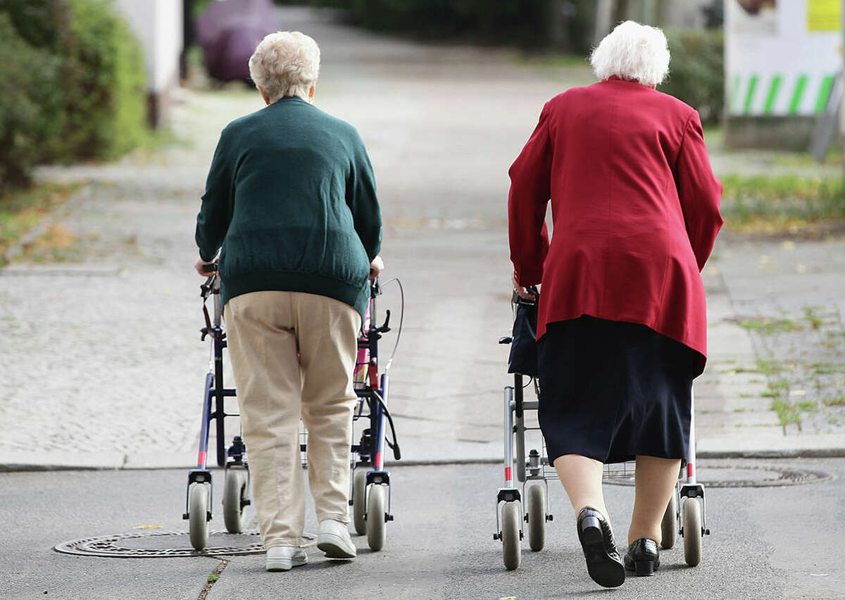 Two elderly women push shopping carts down a street on September 10, 2010 in Berlin, Germany. (Photo by Sean Gallup/Getty Images)