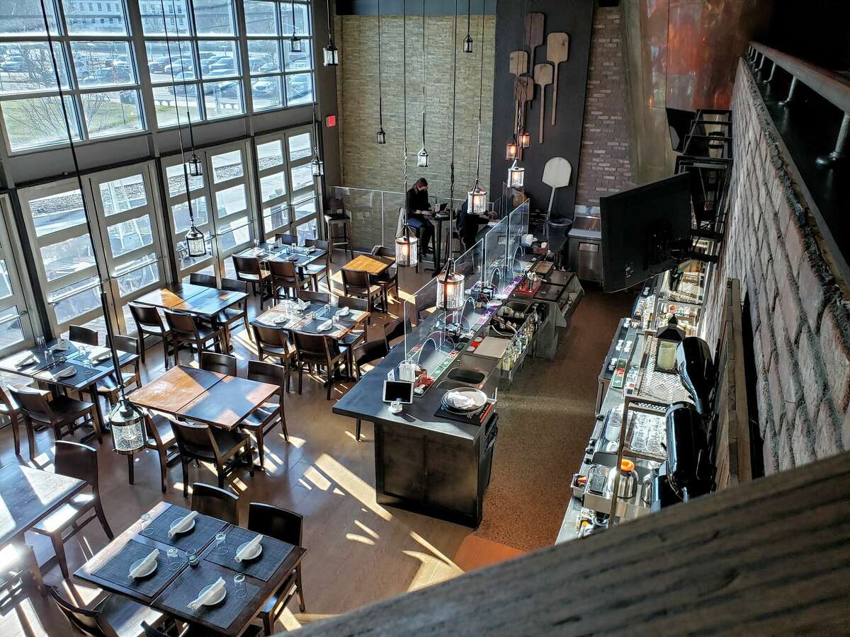 The high-ceilinged dining room at Basso Restaurant and Wine Bar in Westport, Connecticut. 