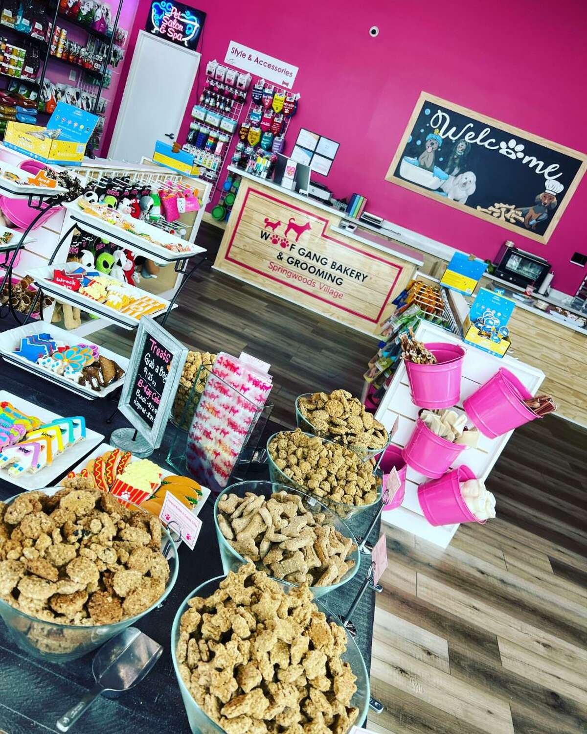 Woof Gang Bakery & Grooming held its grand opening this past weekend along with an adoption event, May 7, at Springwoods Village in Spring, one of two new stores from Amith and Divya Patel, who plan on developing more in the future.