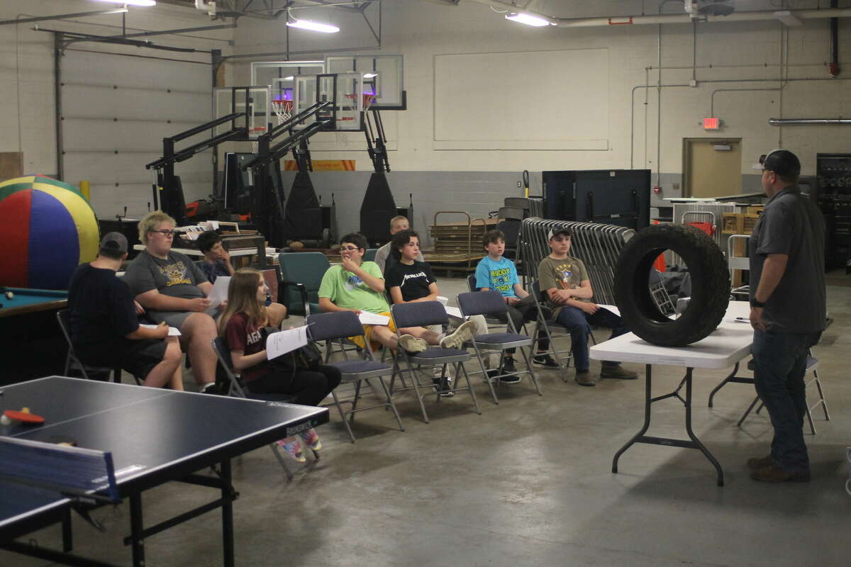 Students attend an auto maintenance class Tuesday at the Armory Youth Project in Manistee.