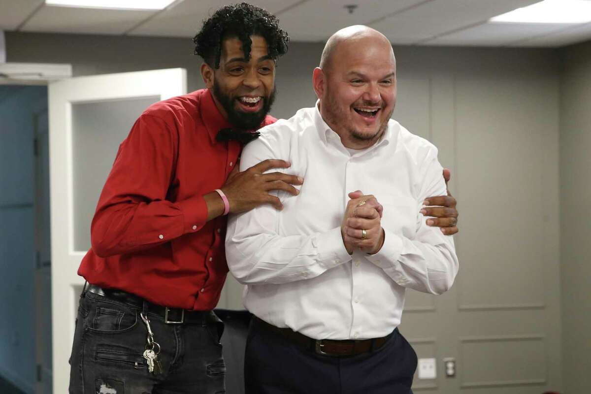 San Antonio College President Robert Vela, right, celebrates with student Greg Torres after SAC was named the top community college in the U.S. by the Aspen Institute during an online presentation May 18, 2021.