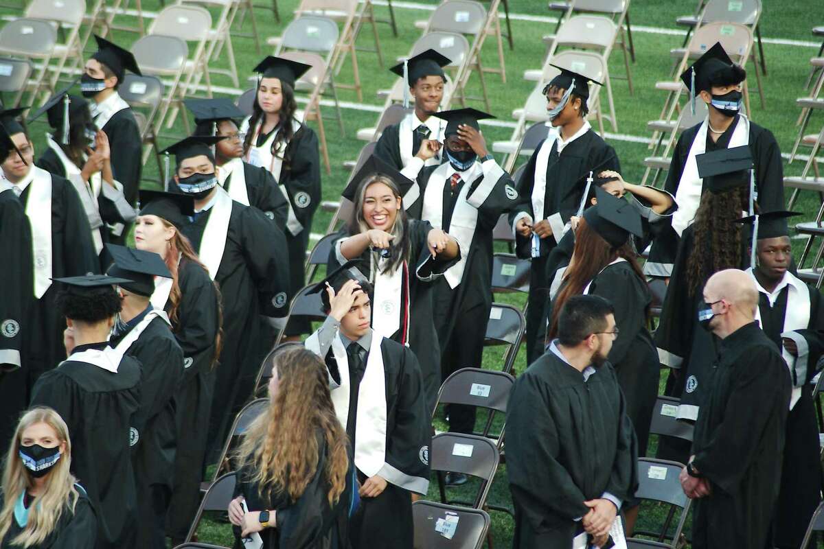 A Shadow Creek High School graduating senior spots a familiar face in the crowd during that school’s graduation ceremonies in 2021. Pearland and Alvin ISDs are preparing for this year’s ceremonies.