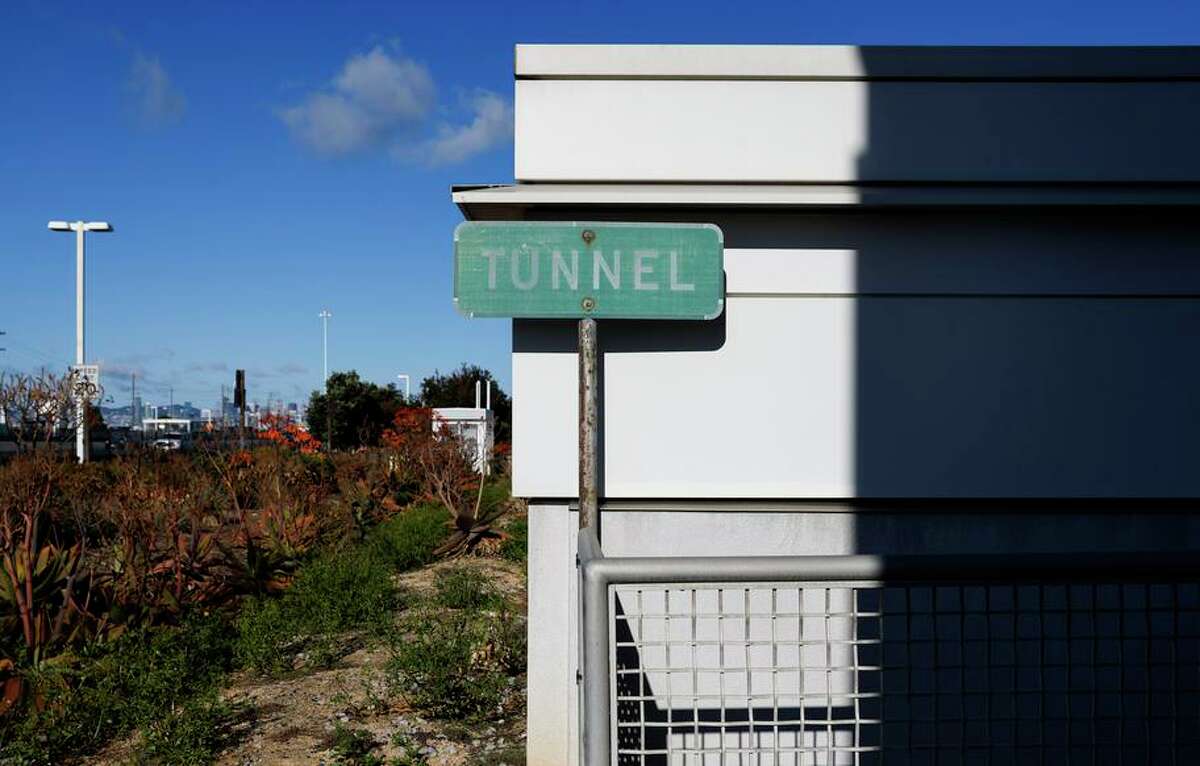 A sign marks a long tunnel leading from the Bay Bridge Toll Authority administration building underneath the eastbound lanes of Highway 80.