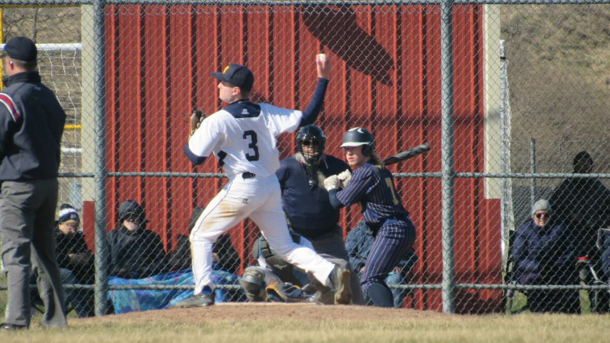 Manistee junior Jeffery Huber successfully picks off a base runner at first against Cadillac on April 21 at Manistee High School